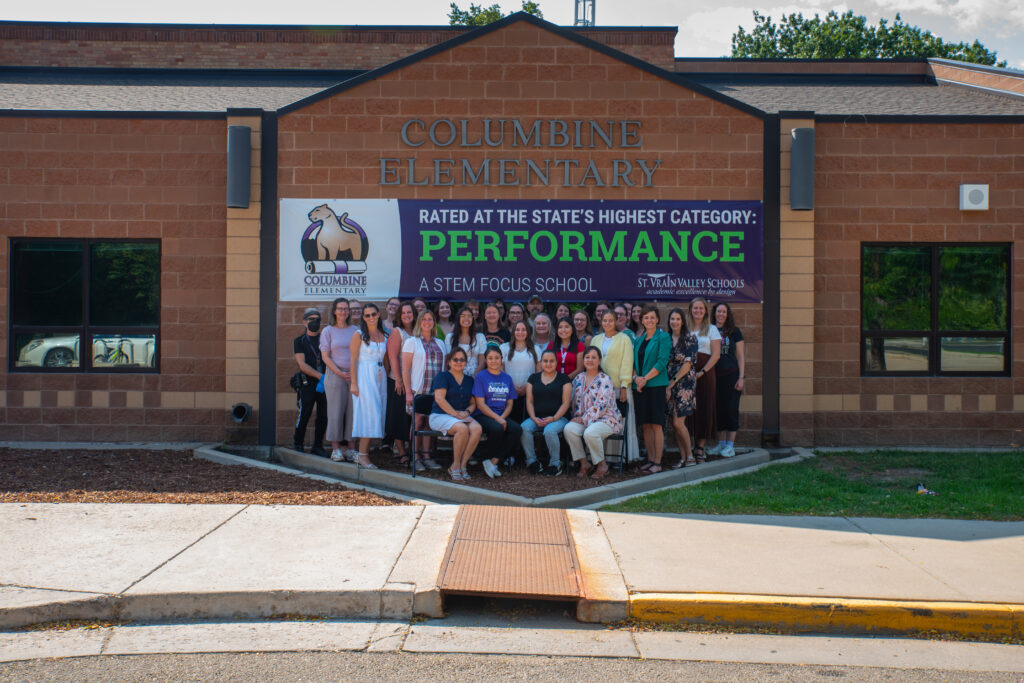 Columbine staff gathers for a photo outside of the school.